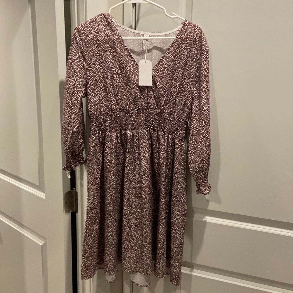 Medium light weight dress. Color brown and white. New with tags